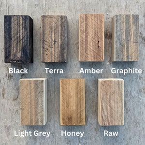 May include: Wood stain samples in various colors, including black, terra, amber, graphite, light grey, honey, and raw.