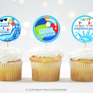 May include: Three blue and white cupcake toppers with a water park theme. The first topper says "Cameron's 7th Birthday! & Kegan's 3rd Birthday!" The second topper says "Splish Splash!" The third topper says "Happy 7th Birthday Cameron & Kegan 3rd Birthday".
