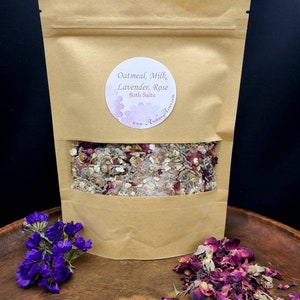 May include: A brown paper bag filled with oatmeal, milk, lavender, and rose bath salts. The bag has a white label that reads "Oatmeal, Milk, Lavender, Rose Bath Salts" with the website address "ArchiesAcres.com".