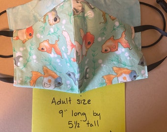 Adorable ornate goldfish and face mask. Reversible double layered cotton fabric.