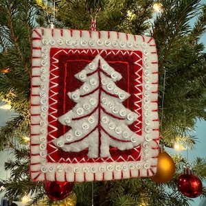 Finished Bucilla felt Nordic tree ornament.
