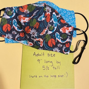 Koi and water lily face mask. Reversible double layered cotton fabric.