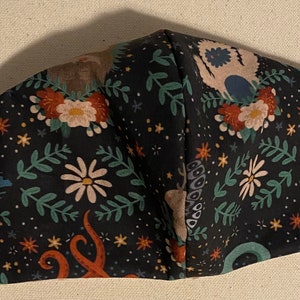 Floral Cryptid  face mask. Reversible double layered cotton fabric.