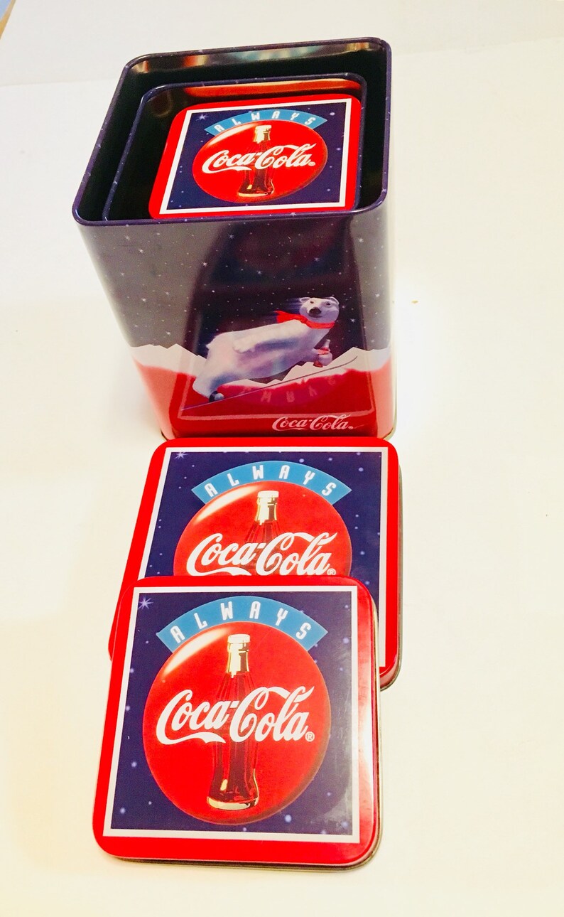 3 different size tins all stack together inside the large tin. 1994 Winter Polar Bear Coca Cola Tin Vintage Coca Cola Brand Tins