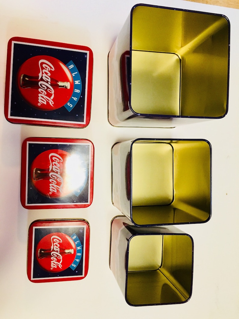 3 different size tins all stack together inside the large tin. 1994 Winter Polar Bear Coca Cola Tin Vintage Coca Cola Brand Tins