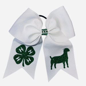 May include: White cheer bow with a green 4-H clover and a green glitter goat on each side.