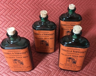 Four Green Seed Bottles