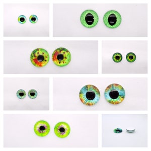 May include: Assortment of colourful glass eyes for crafts and doll making. The eyes are various sizes and feature different patterns, including green, blue, and red.