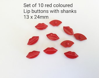 May include: Set of 10 red lip-shaped buttons with shanks. Each button measures 13 x 24 mm.