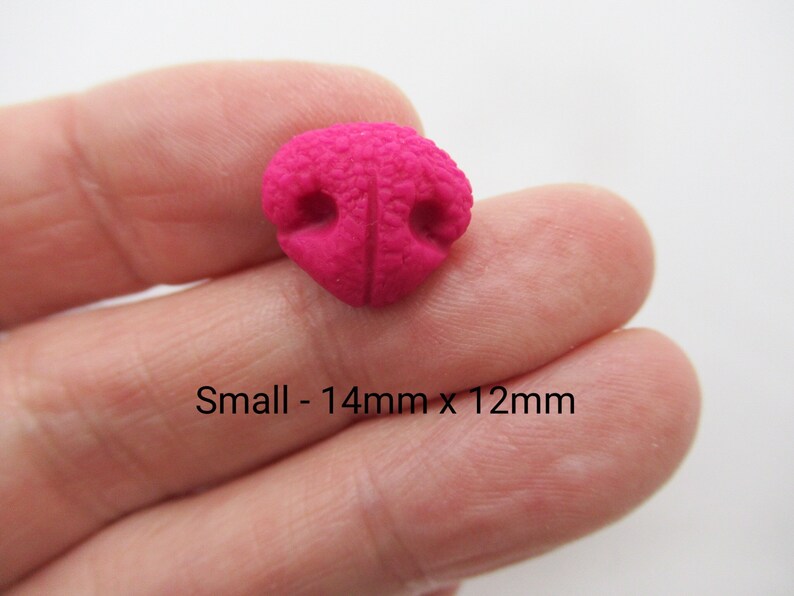 May include: A small, bright pink, plastic nose with two holes. The nose is 14mm x 12mm.