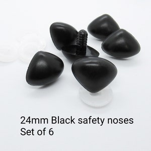 May include: Set of six 24mm black plastic safety noses for stuffed animals or crafts. The noses have a triangular shape and a small hole for attaching.