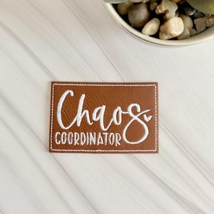 Chaos coordinator embroidered leather hat patch