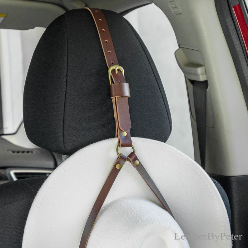 Handmade adjustable leather cowboy hat hanger for a car headrest
