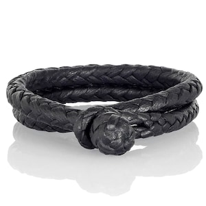 May include: A black leather bracelet with a braided design. The bracelet wraps around twice and features a woven knot closure. The leather appears to be smooth and the overall design is simple and elegant.