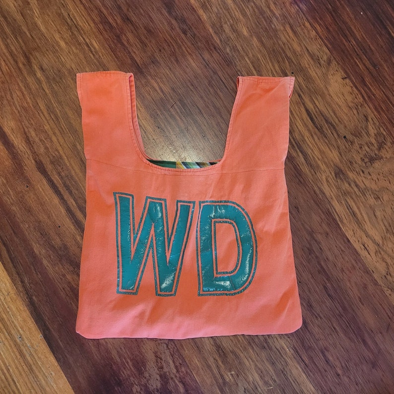 Orange netball bib bag with green lettering reversible unique gift netball fans, gift for mum, gift for coach zero waste, reusable bag image 1