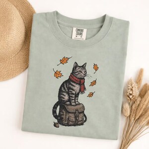 Comfort Colors Cute Autumn Cat Sweatshirt, Cozy Fall Kitty with Red Scarf, Falling Leaves Pullover, Whimsical Seasonal Cat Lover Gift image 1