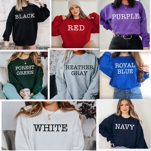May include: A collage of nine images showcasing different color options for a crewneck sweatshirt. The colors include black, red, purple, forest green, heather gray, royal blue, white, and navy.