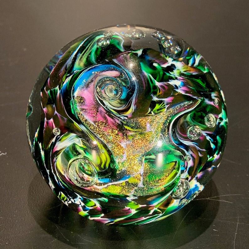 This artwork boasts a harmonious blend of vibrant colors. Turquoise, New Green, Purple, and Lemon Yellow delicately dance together, creating a stunning visual spectacle. The swirling patterns mimic the elegant movement of the Aurora Borealis.