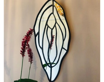 Mirror, vulva, stained glass