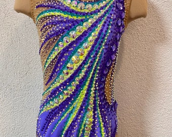 May include: A purple leotard with a green and yellow design and rhinestones. The leotard has a scoop neck and sleeveless design.