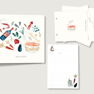 Könnte beinhalten: Eine Aquarell-Illustration eines Suppentopfs mit Deckel, Gemüse, Gewürzen und einer Flasche Wein. Die Illustration befindet sich auf einer weißen Karte mit dem Text "Meine Rezepte" in schwarzer Schrift. Die Karte ist Teil eines Rezeptordners mit Trennblättern und Rezeptkarten.