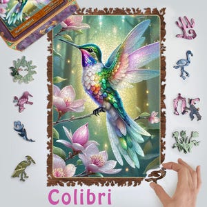 May include: A 500-piece jigsaw puzzle featuring a colorful hummingbird perched on a branch with pink flowers. The puzzle is framed in wood and includes several smaller pieces that fit together to create the complete image. The puzzle is titled "Colibri" and is a beautiful and challenging puzzle for adults and children.