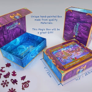 Pode incluir: Uma caixa roxa e dourada com uma cena de inverno na frente. A caixa mede 23 cm por 28,5 cm e diz "Dreamion Puzzles" e "Christmas Town".