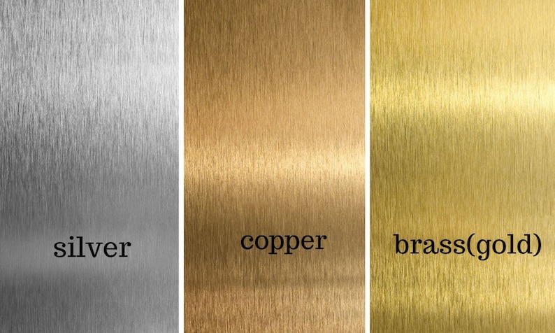 May include: Close-up of three metal samples with brushed finishes. The samples are labeled "silver", "copper", and "brass(gold)".
