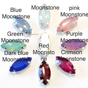 May include: Assortment of marquise-shaped moonstone gems in various colors, including blue, green, pink, purple, red, crimson, and dark blue.