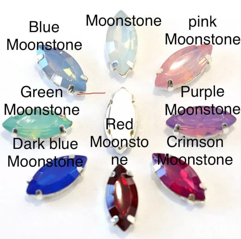 May include: Assortment of marquise-shaped moonstone gems in various colors, including blue, green, pink, purple, red, crimson, and dark blue.
