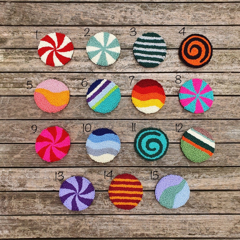 May include: Fifteen colorful round wool rug designs with numbers 1 through 15. The designs include swirls, stripes, and geometric patterns in various colors, including red, blue, green, yellow, orange, and purple.