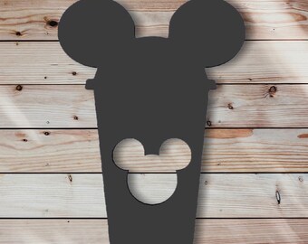 May include: Black silhouette of a coffee cup with Mickey Mouse ears and a Mickey Mouse face cutout on the front.