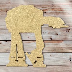 May include: A beige wooden cutout of a Star Wars AT-AT walker. The walker is standing on a woodgrain background.