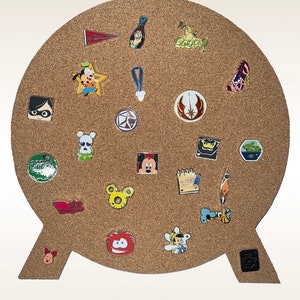 May include: A corkboard shaped like a speech bubble with various Disney character pins attached. The pins feature characters like Mickey Mouse, Minnie Mouse, Goofy, and others.