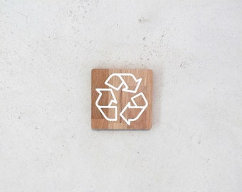 Wooden sign with recycling pictogram. Sign for sorting bin. Modern oak sign with recycling and eco sorting logo.