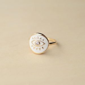 White enamel, zirconium and gold plated eye ring - Osiris