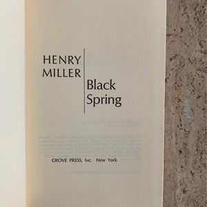 May include: A book cover with the title "Black Spring" by Henry Miller. The book is published by Grove Press, Inc. in New York.