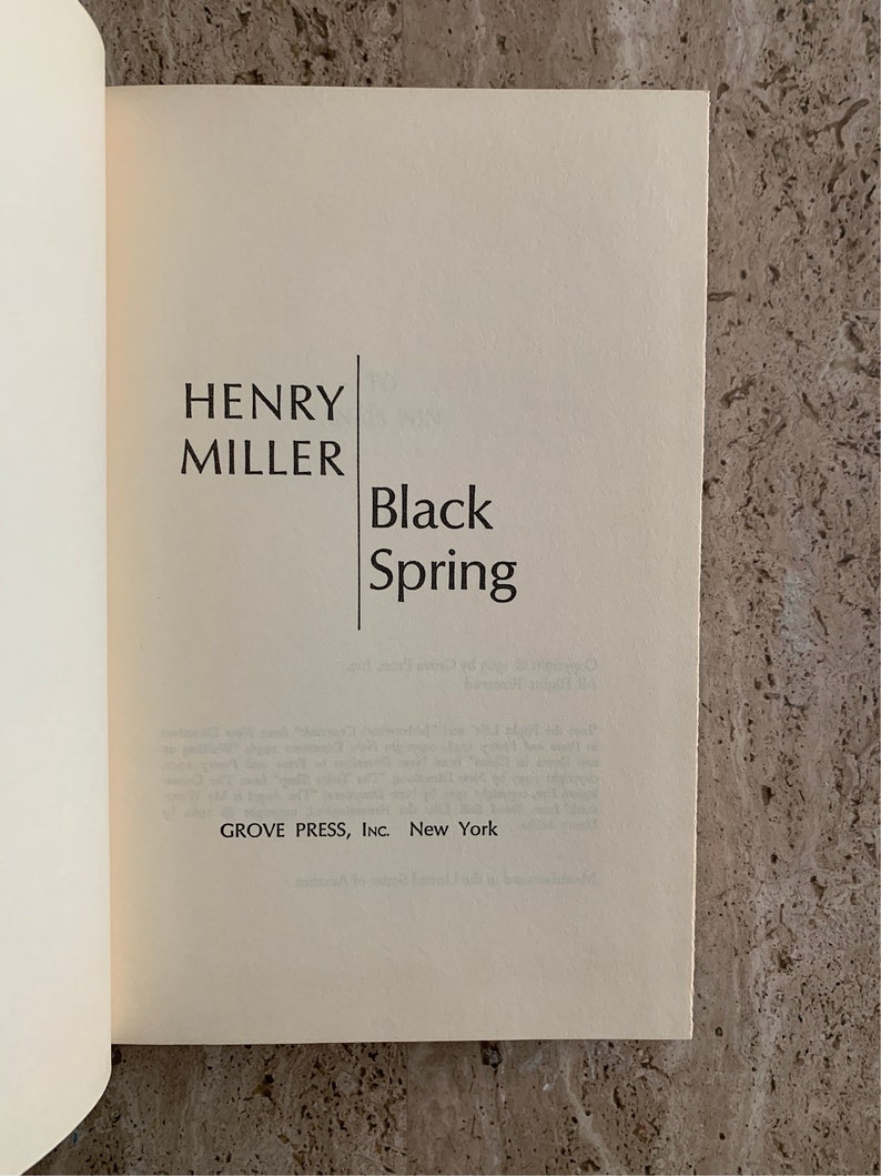 May include: A book cover with the title "Black Spring" by Henry Miller. The book is published by Grove Press, Inc. in New York.