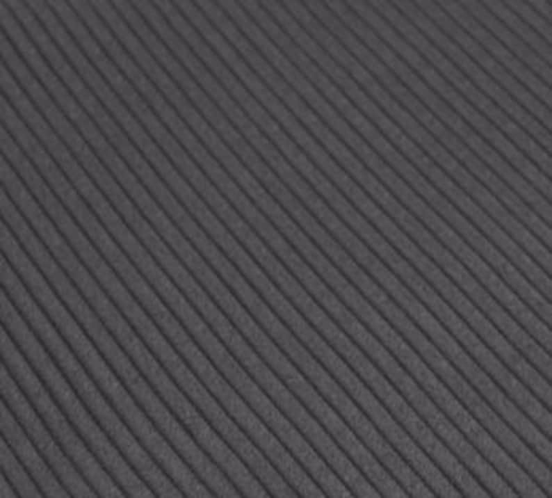 May include: A dark gray fabric featuring a consistent, fine-ribbed texture running diagonally across the surface. The material displays a uniform matte finish with parallel raised lines that create a subtle, repeating linear pattern throughout.