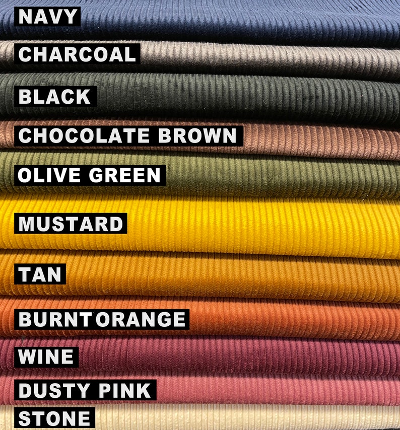 May include: A collection of corduroy fabric swatches stacked horizontally, featuring the colors navy, charcoal, black, chocolate brown, olive green, mustard, tan, burnt orange, wine, dusty pink, and stone, each labeled with its respective name.