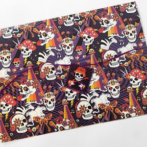 May include: A colorful wrapping paper with a psychedelic skull pattern. The skulls are wearing headphones, sunglasses, and have multiple eyes. The background is a mix of black, purple, orange, and yellow.