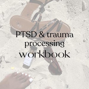May include: A pair of brown sandals with leopard print straps, sunglasses, and a small bottle rest on sand. The text "PTSD & trauma processing workbook" is displayed in black font.