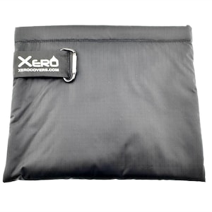 May include: A black, zippered pouch with a silver D-ring and the text "Xero Xerocovers.com" printed in white.