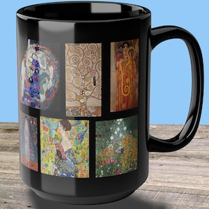 May include: Black ceramic coffee mug with a collage of colorful paintings by Gustav Klimt. The mug features images of "The Kiss", "Tree of Life", "Judith and Holofernes", and other famous works.