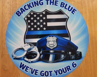 Round Aluminum "Backing the Blue, We've Got Yor 6" sign.