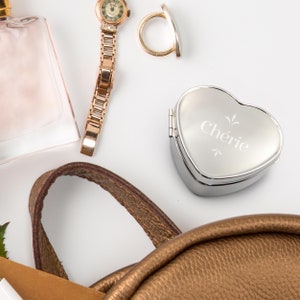 Pill box with heart-shaped engraving