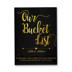 May include: A black and gold printable journal cover with the text "Our Bucket List" and the names "Julie & Andrew". The text "Pursuing the lives of our dreams. Journaling inspiration for couples" is also included.