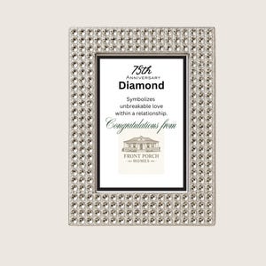 Puede incluir: Un marco de fotos rectangular con un borde plateado incrustado con numerosos cristales transparentes facetados. El inserto muestra el texto: 75th Anniversary Diamond, Symbolizes unbreakable love within a relationship. Congratulations from Front Porch Homes.