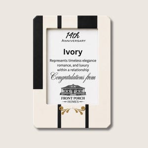 Puede incluir: Un marco de fotos rectangular con un borde de color marfil y negro. El inserto presenta el texto 14th Anniversary, Ivory, Represents timeless elegance romance, and luxury within a relationship, Congratulations from y Front Porch Homes.