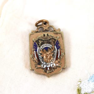 May include: A white ceramic mug with a black handle and the text "But First, Coffee" in a bold, black font. The mug is set against a blurred background, highlighting its clean design.